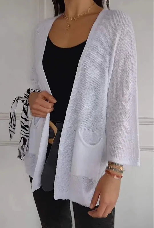 Women's waffle knit cardigan coat with nine-quarter length sleeves and pockets in army green.