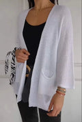 Women's waffle knit cardigan coat with nine-quarter length sleeves and pockets in army green.