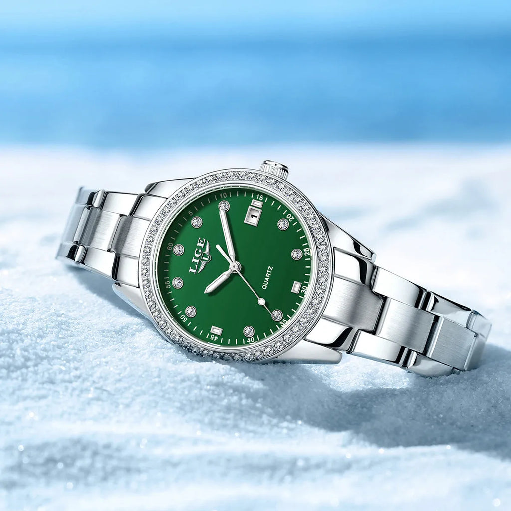 Silver quartz watch with diamond encrusted dial and luminous hands on stainless steel strap