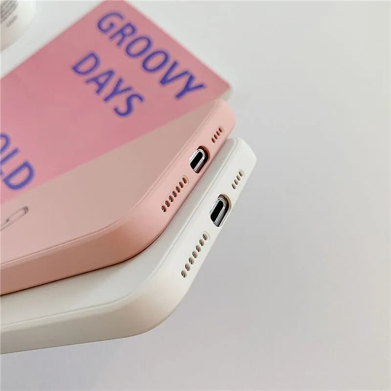 Solid colour silicone TPU phone case for Apple iPhone on a table.