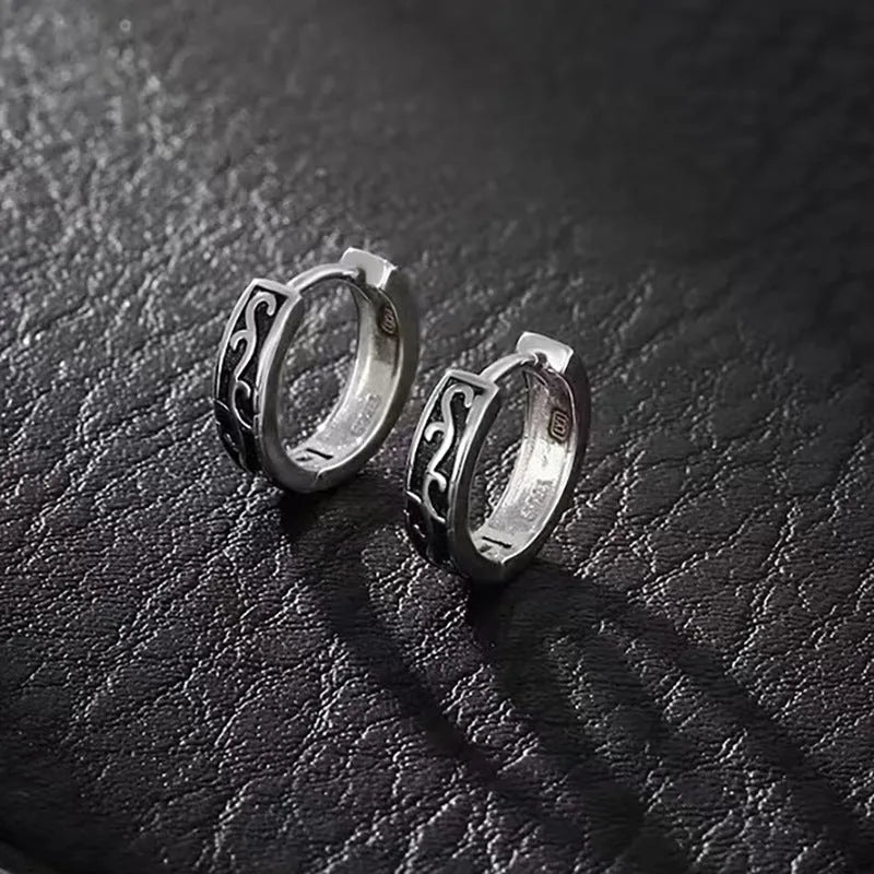 Men's geometric copper stud earrings shown in 10mm and 14mm sizes on a dark background.