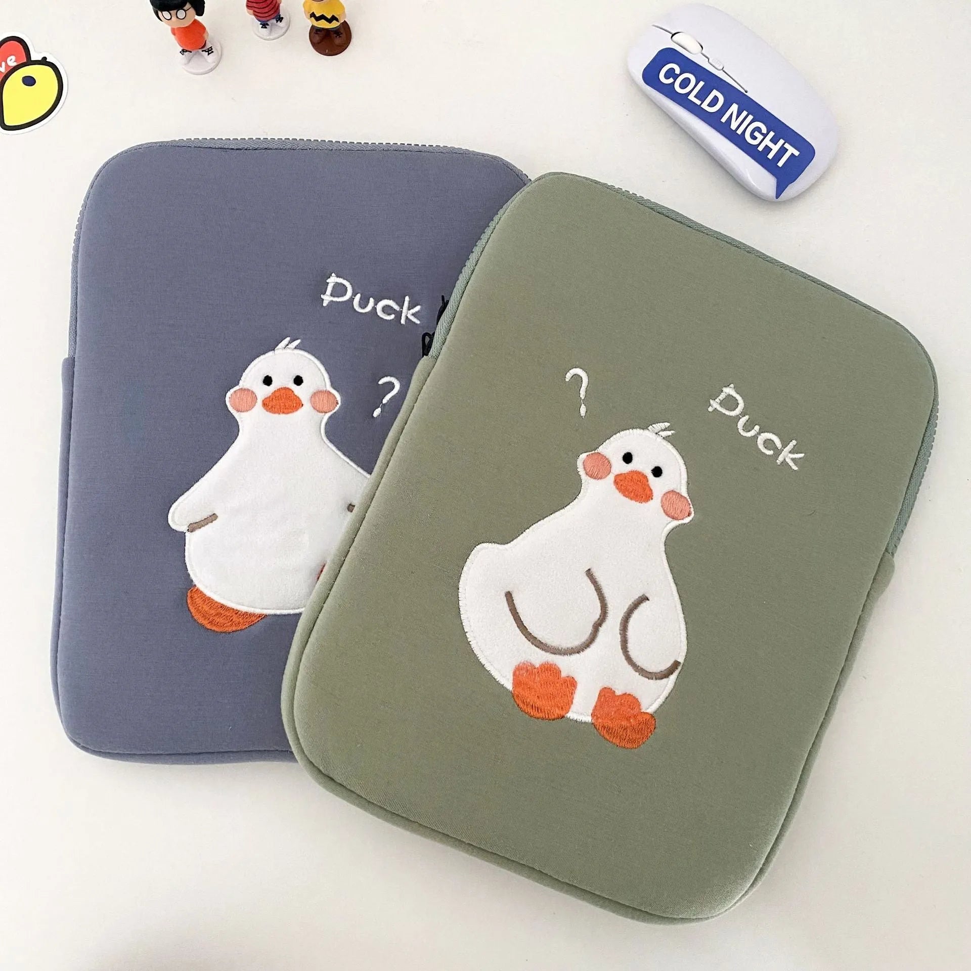 Cotton tablet case with cartoon duck embroidery design in blue or green colours with zipper closure