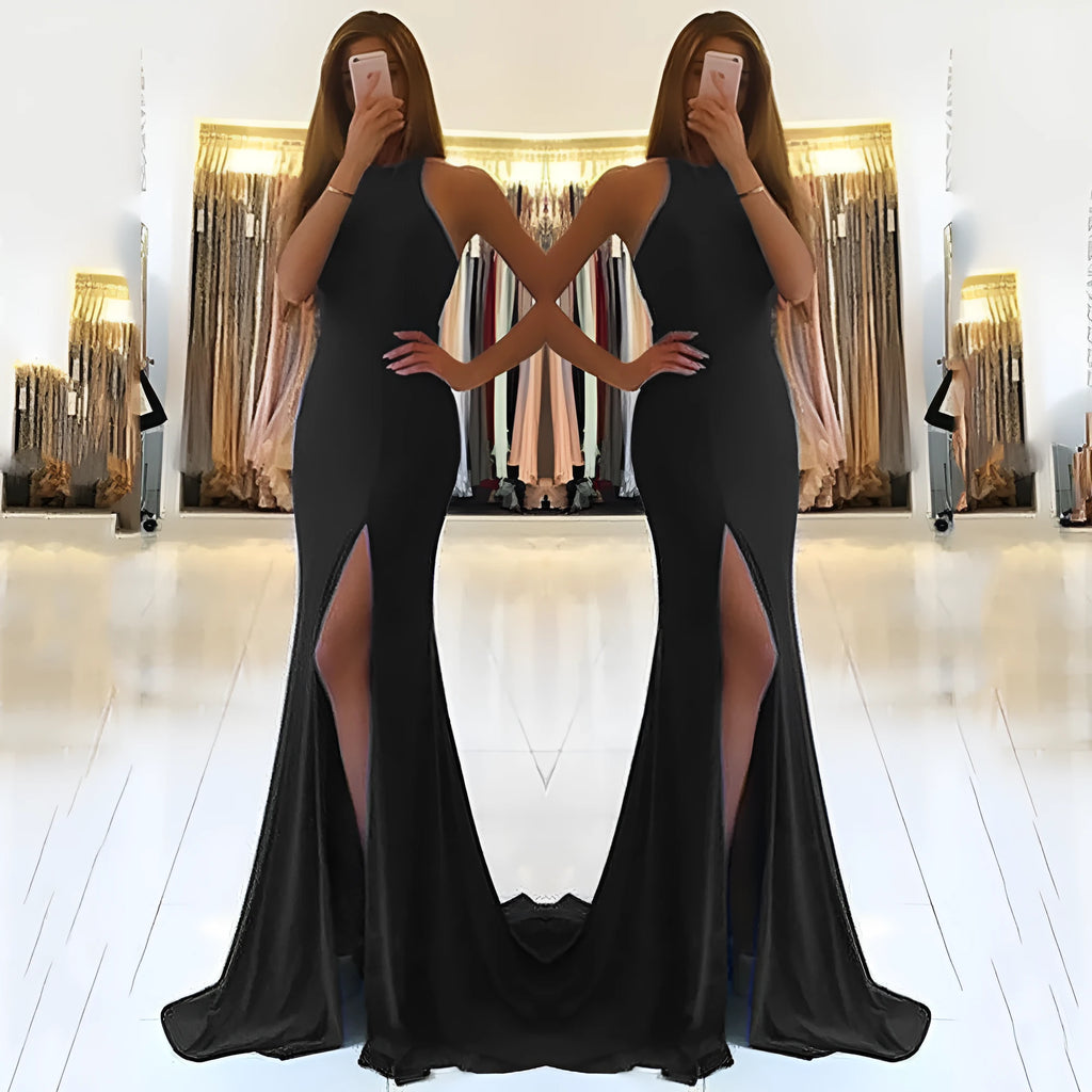Long red knitted evening dress with hollow design detail on the skirt and a hanging neckline.