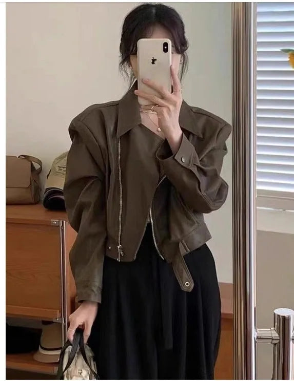 Women's brown retro imitation leather jacket with long sleeves, slim fit, and pockets.