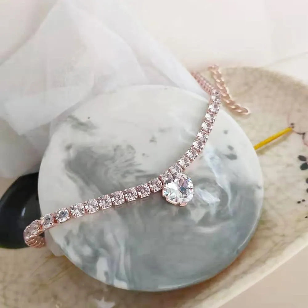Gold rhinestone heart-shaped decorative collar for dogs or cats on a metal chain.
