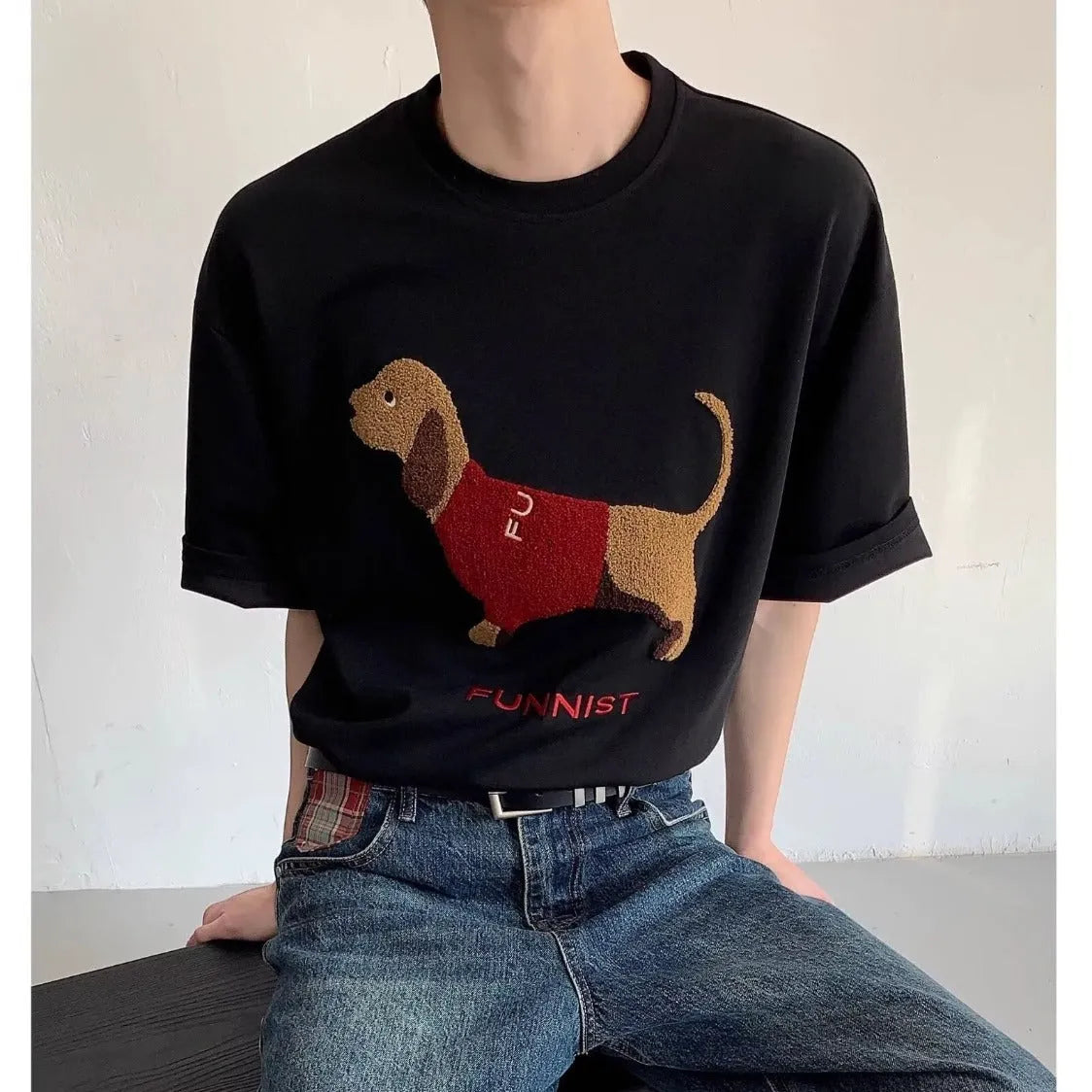 Men's grey cotton t-shirt with embroidered sausage dog holding towel design showing front view