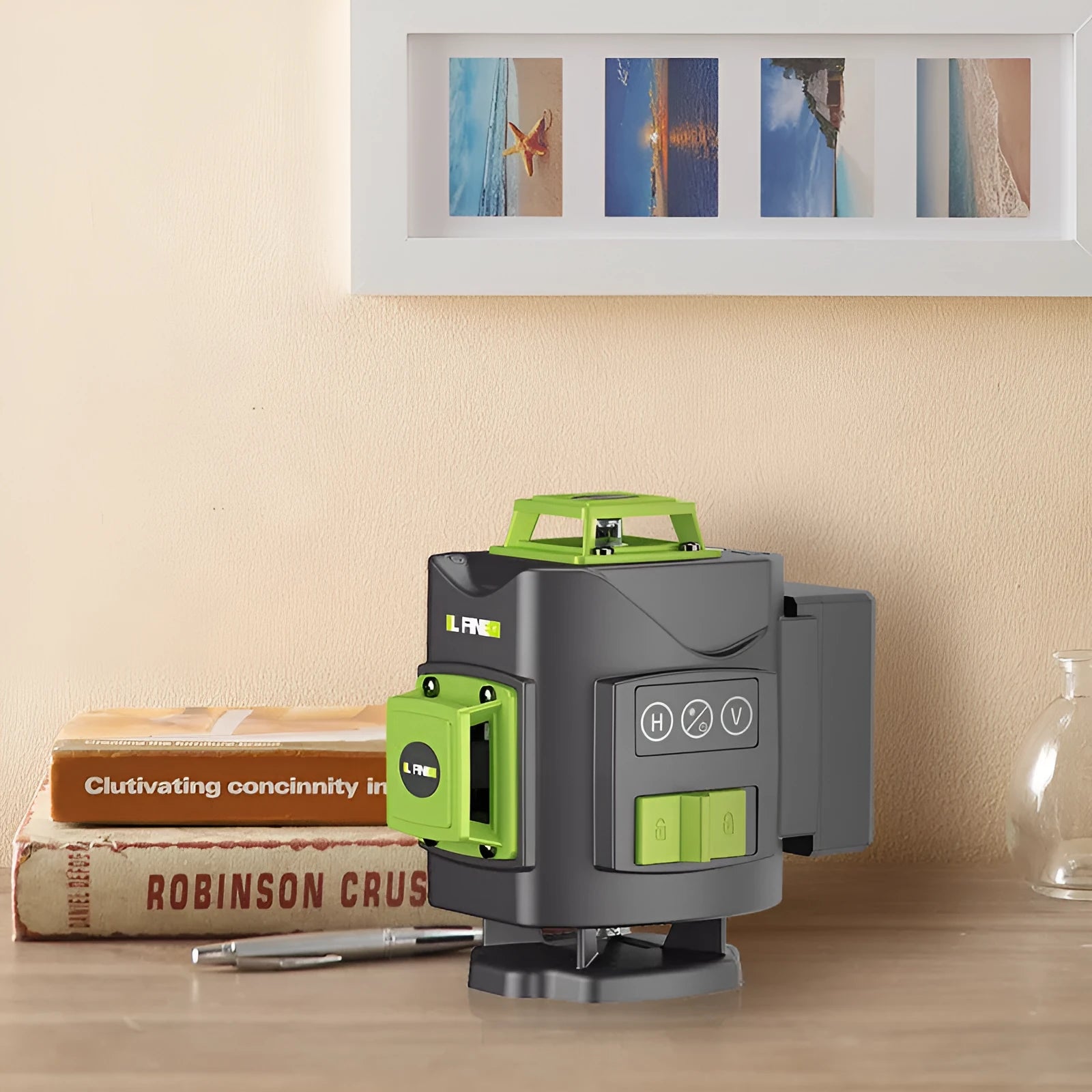 Green 16-line 3D laser level with compact black housing on a work surface.