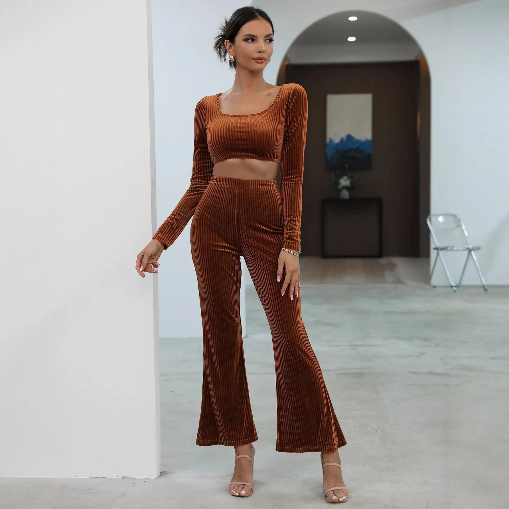 Caramel coloured long sleeve sweater and trouser casual set laid flat.