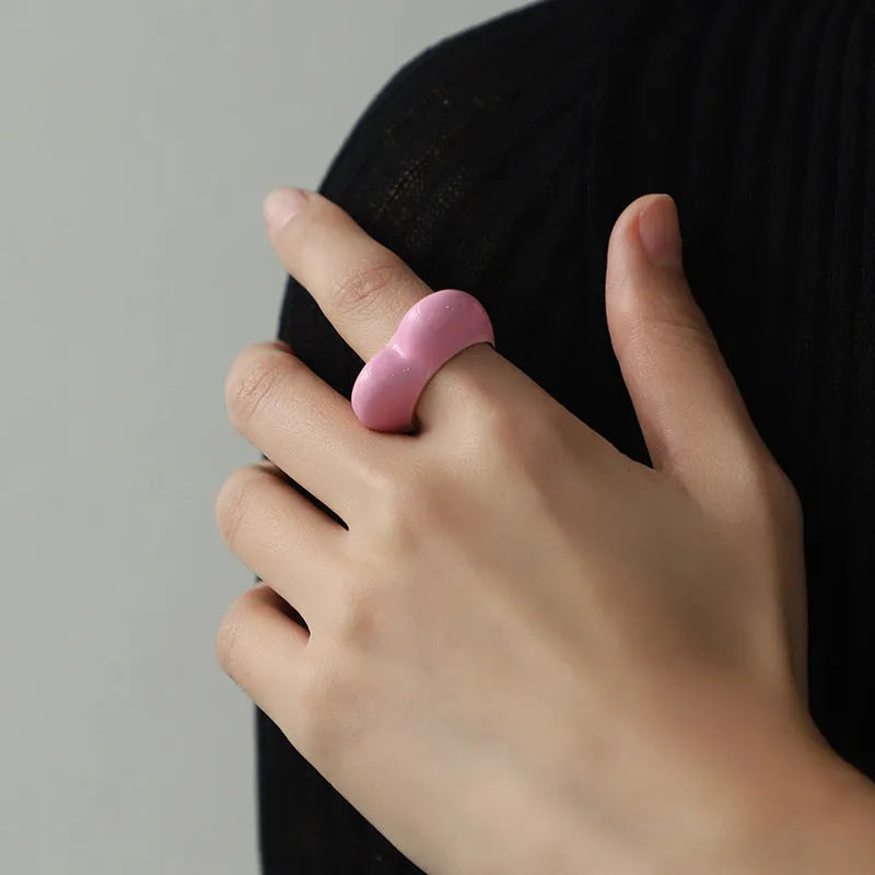 Three-dimensional heart-shaped enamel ring in zinc alloy, shown in choice of colours.