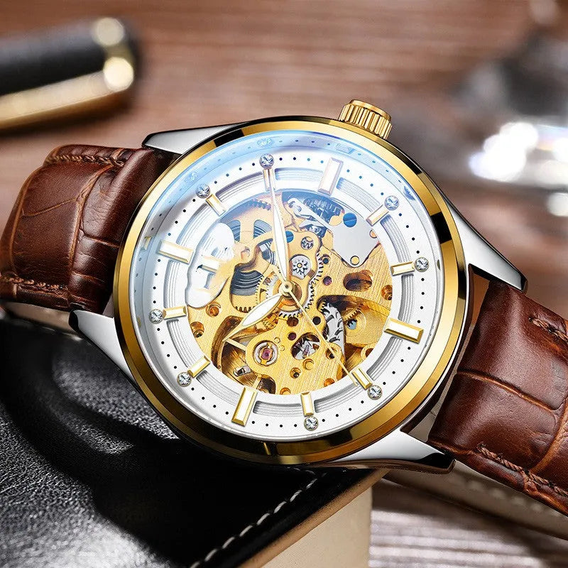Gold shell mechanical watch with brown leather strap and white dial on a wrist