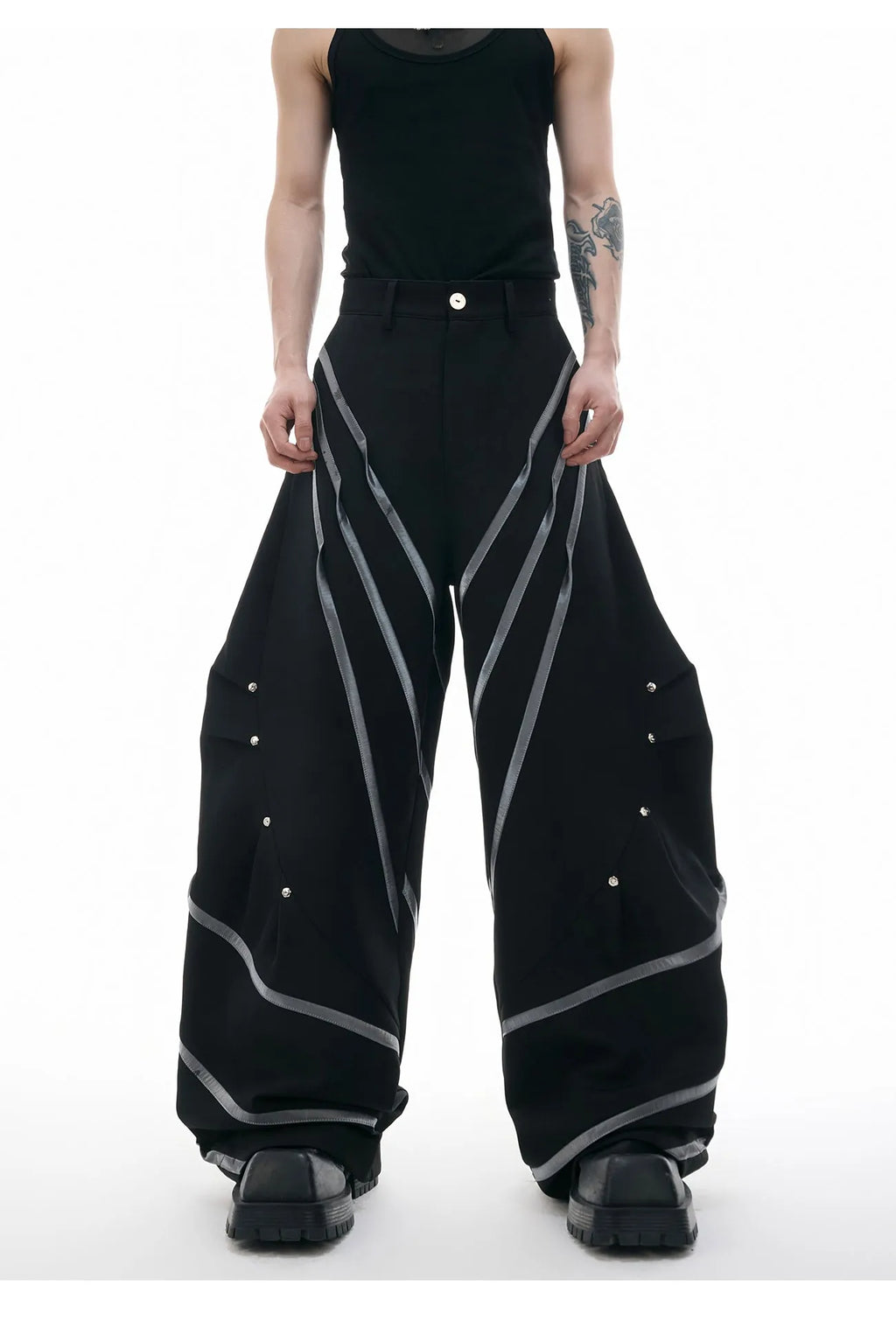 Men's grey polyester trousers with metal rivet stripes, front pleats, and a 3D cut, shown in sizes S to XL.