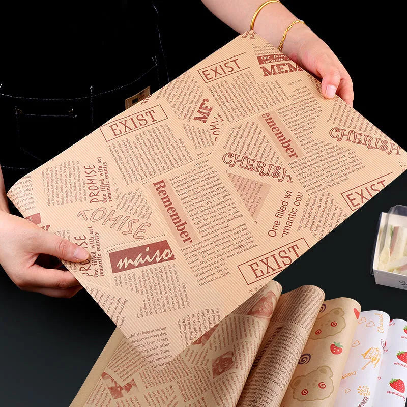 Stack of 28x38cm microwaveable food grade anti-oil Kraft baking paper sheets in English, newspaper, and retro styles