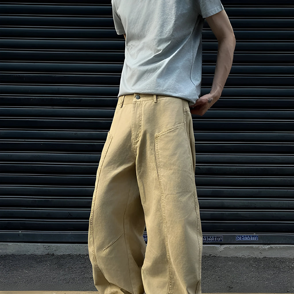 Men's khaki cotton straight-leg trousers with American retro styling laid flat