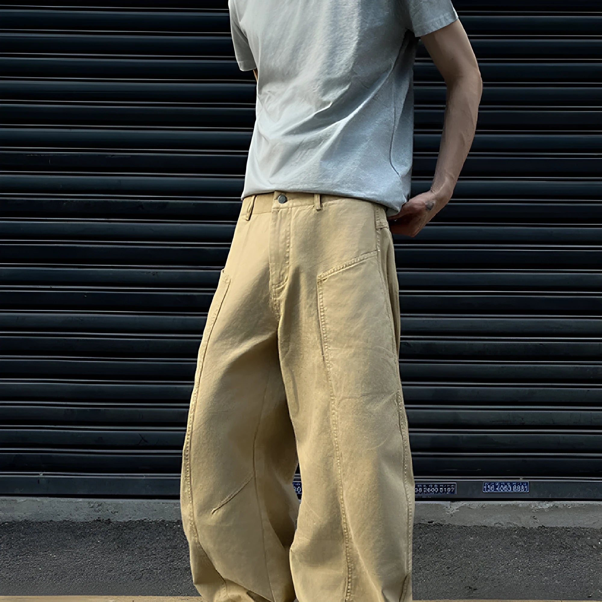 Men's khaki cotton straight-leg trousers with American retro styling laid flat