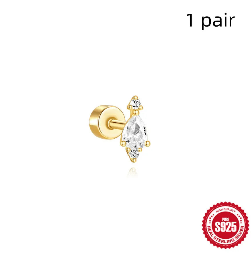 A pair of geometric S925 sterling silver ear bone studs with a flat column thread post, shown in a gold tone finish.