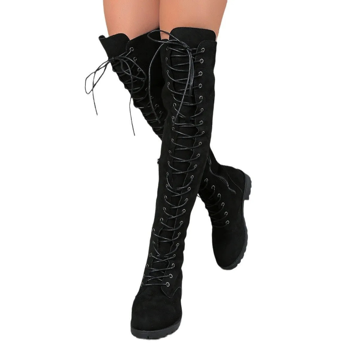 Black lace-up over the knee boots with round toe and flat rubber sole on a neutral background.