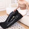 Electric leg massager with air wave compression cuffs in neutral colour showing control panel and leg wraps