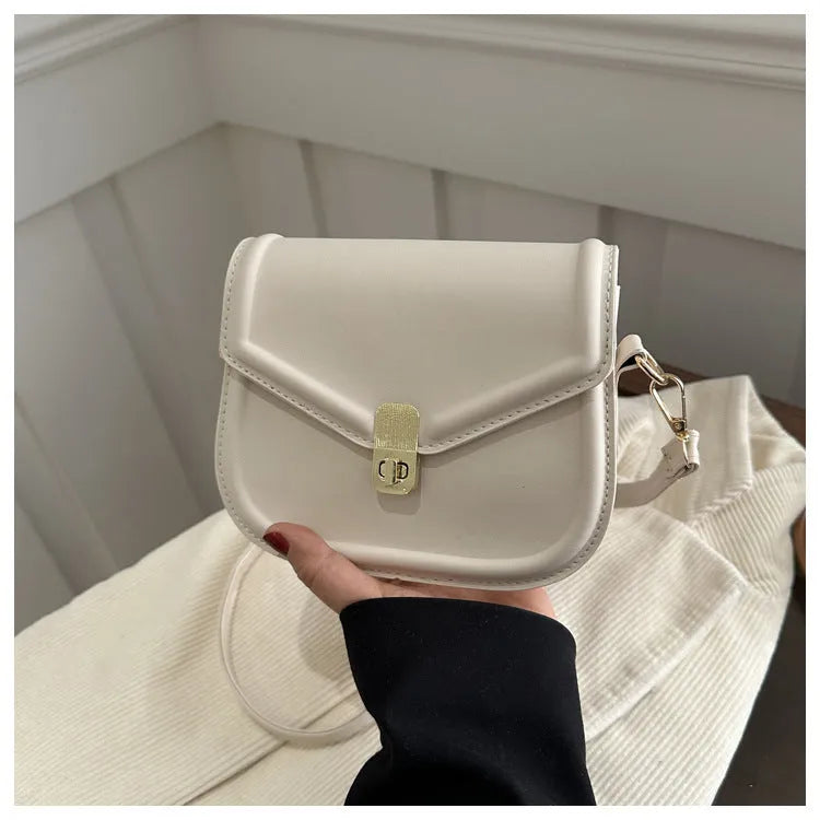 Soft horizontal square messenger bag in clamshell design, shown in black colour.