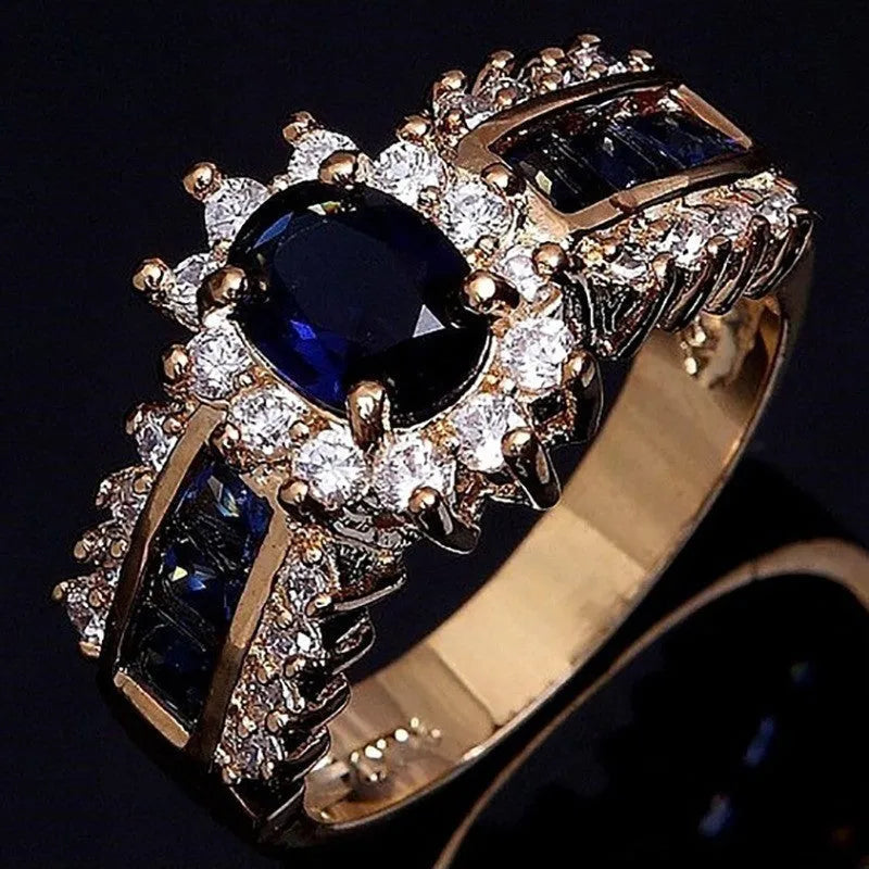 Zinc alloy personalised ring showing sunflower blue diamond and square-cut blue and purple zircon designs.