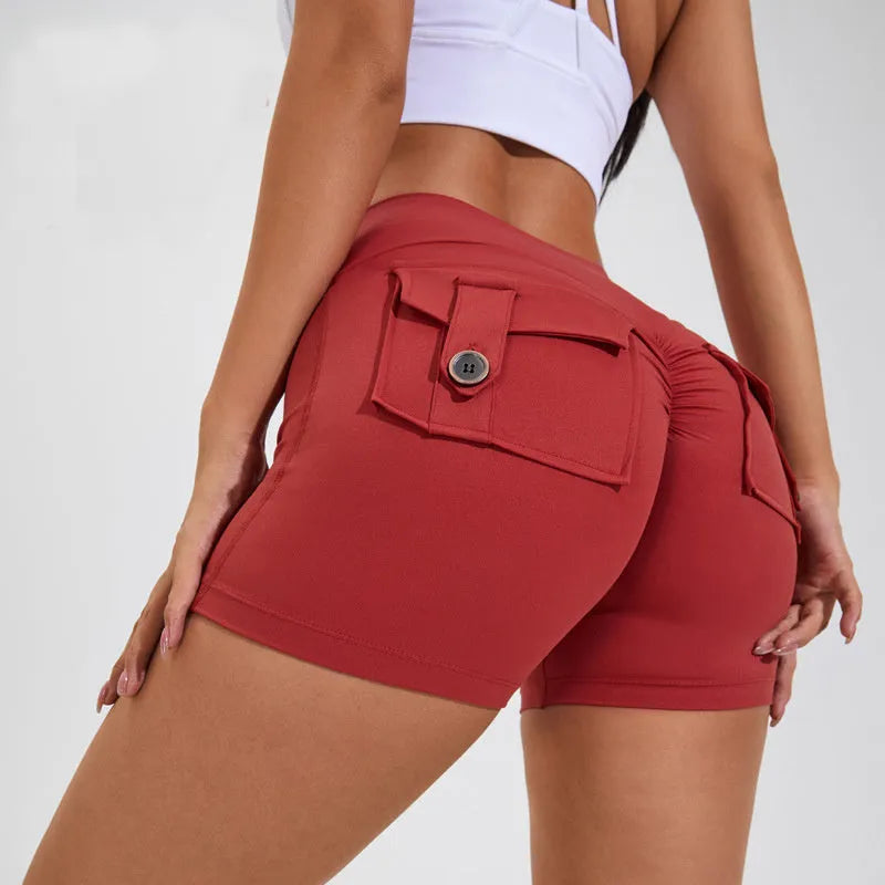 Women's high-waist fitness shorts with pockets in quick-dry nylon fabric, shown in Electric Blue colour
