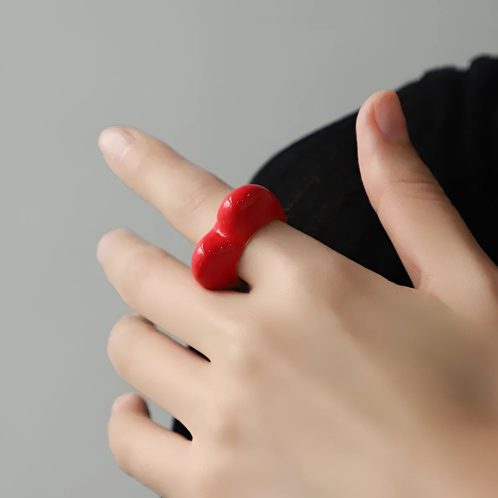 Three-dimensional heart-shaped enamel ring in zinc alloy, shown in choice of colours.
