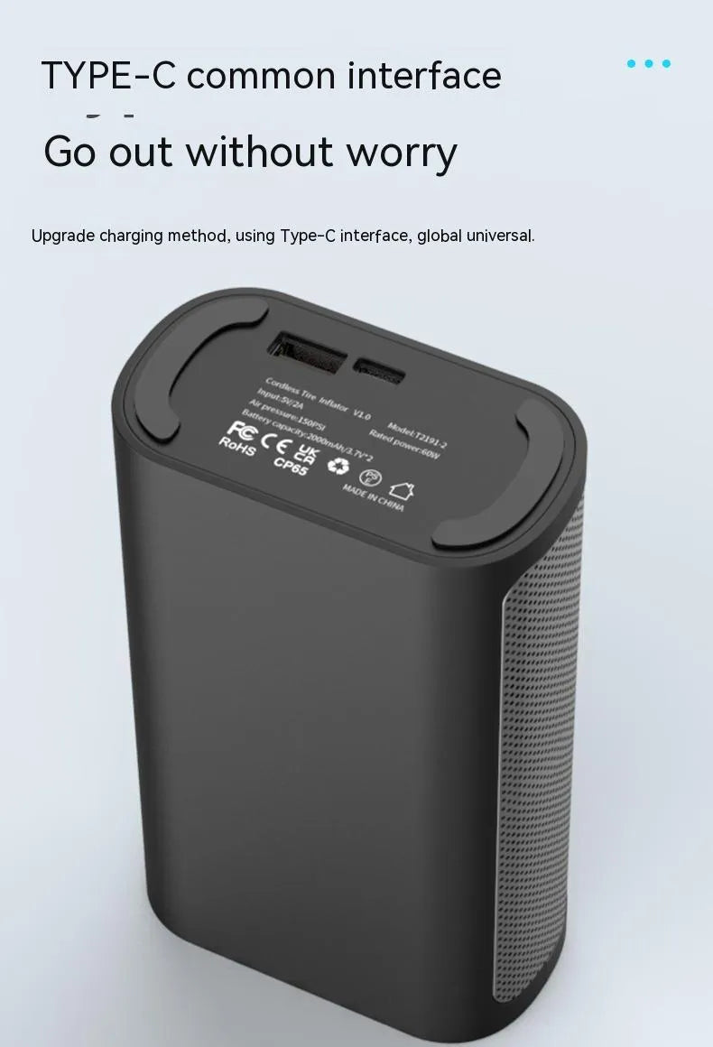 T2191-2 handheld wireless digital display air pump with LED light and multiple nozzle attachments on a table.