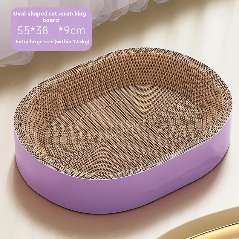 Green oval corrugated paper cat scratch board measuring 55cm across, functioning as both scratching surface and cat nest