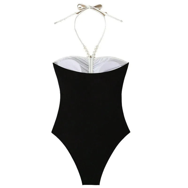 Women's black and white one-piece swimsuit with pearl spaghetti straps for swimming