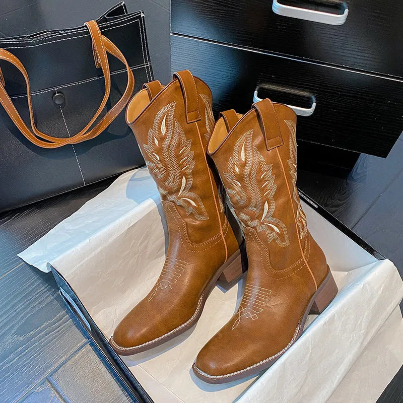 Brown women's embroidered Martin boots with mid-calf length, square heel, and round toe