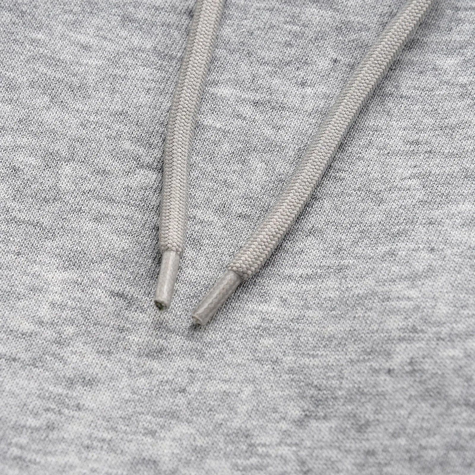 Men's grey cotton trousers with straight wide-leg fit on hanger