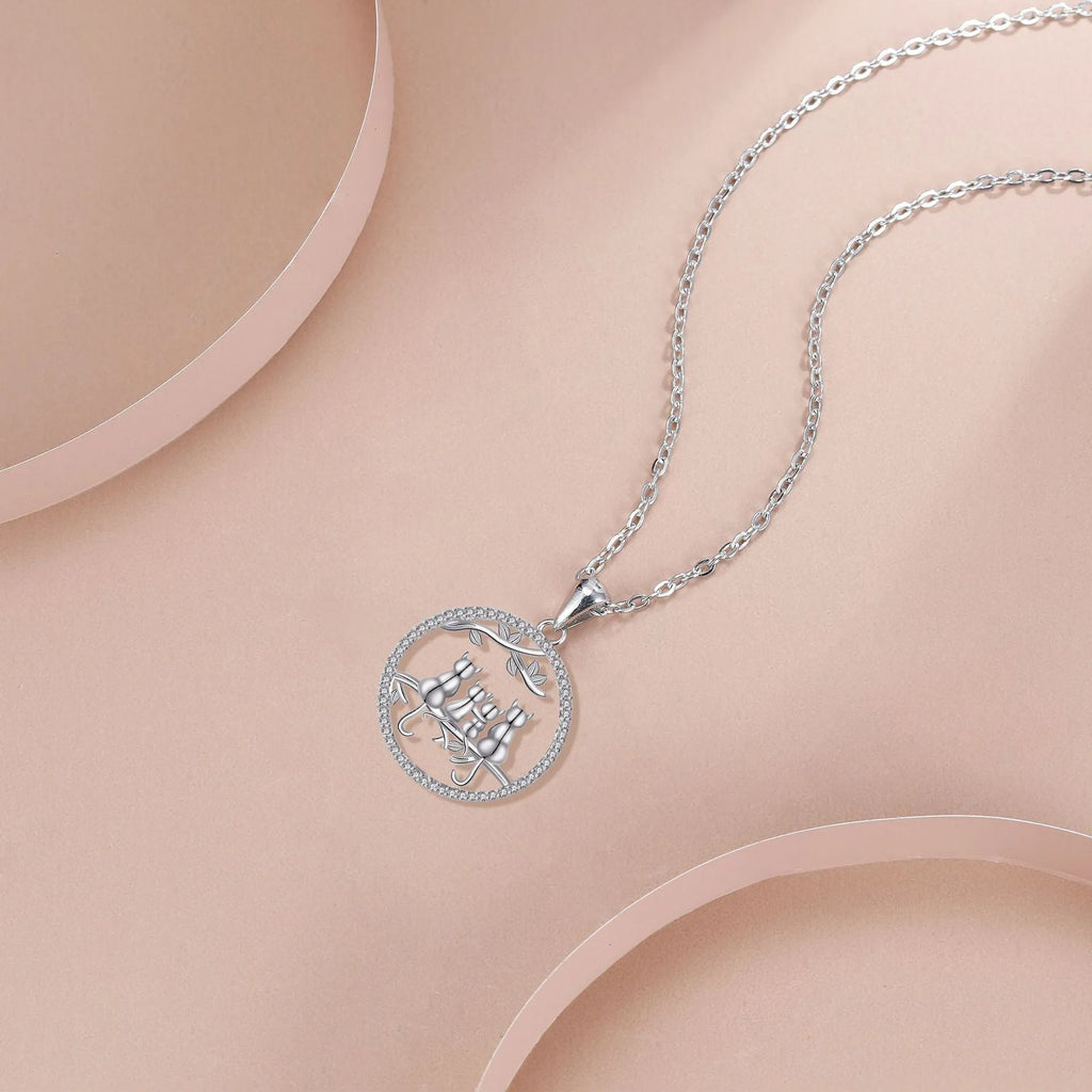 Original design copper necklace with four kitten pendants on a cross chain for women.