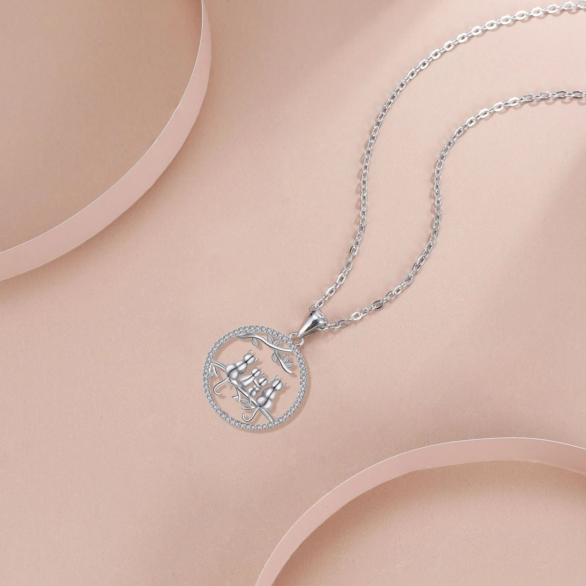 Original design copper necklace with four kitten pendants on a cross chain for women.