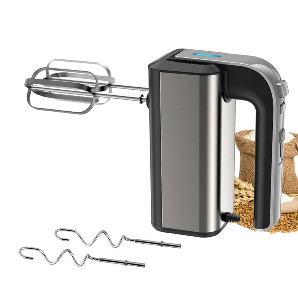 Silver mini electric hand whisk with stainless steel beaters on a kitchen counter.