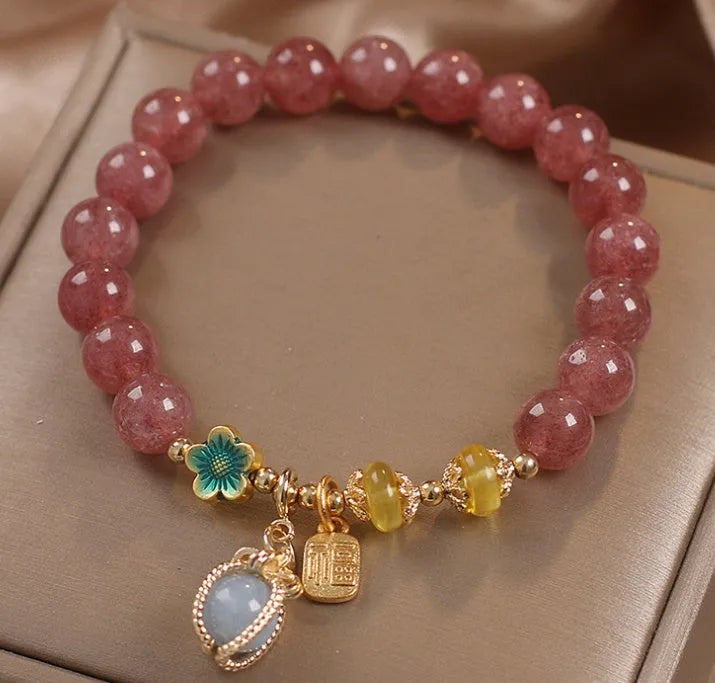 Red strawberry quartz beaded bracelet with alloy metal accents and rhinestone decorative details for women