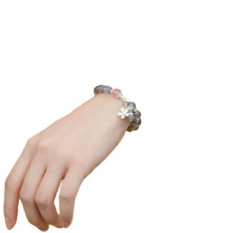 Women's silver bracelet with 7.5mm gray moonlight stone and zodiac design.