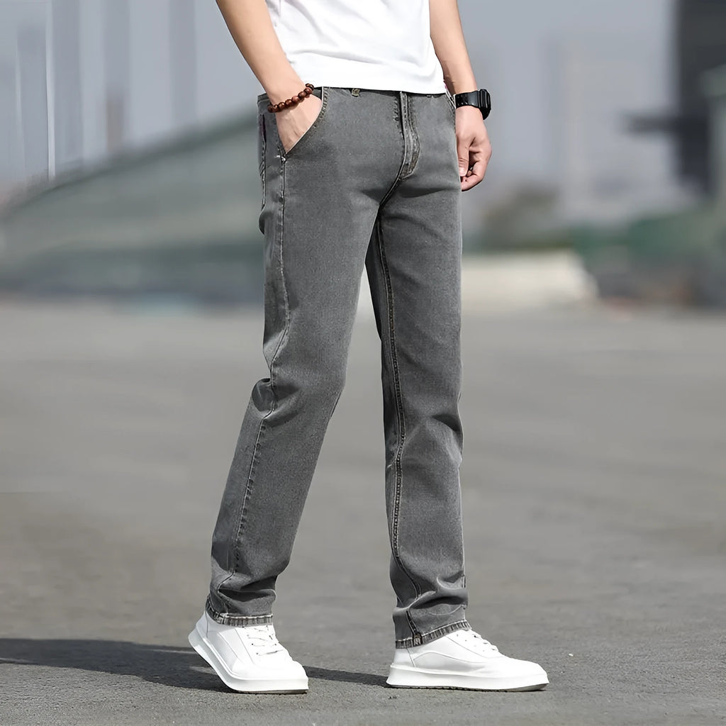 Men's autumn smoky grey straight leg jeans with high elasticity and low waist design