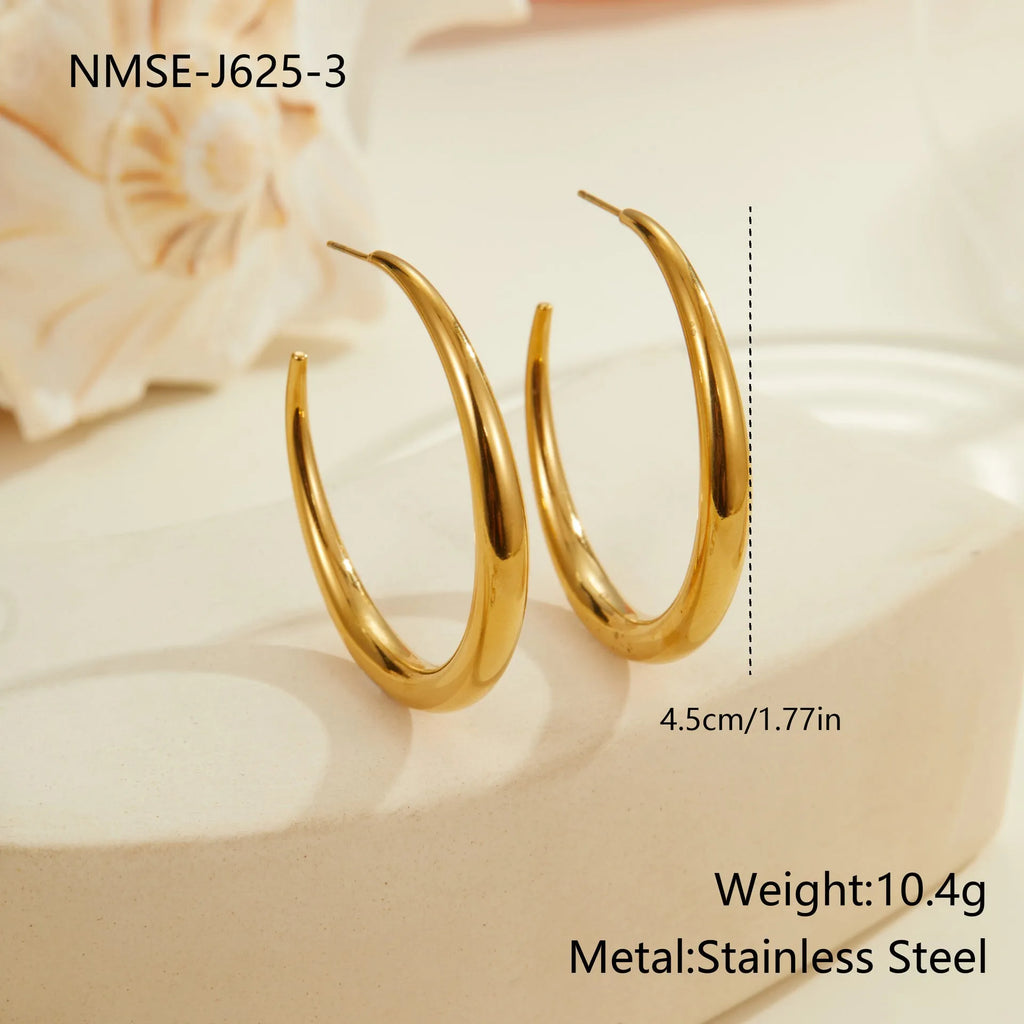 Titanium steel hoop earrings in gold and steel finishes, available in large and small sizes with simple geometric design