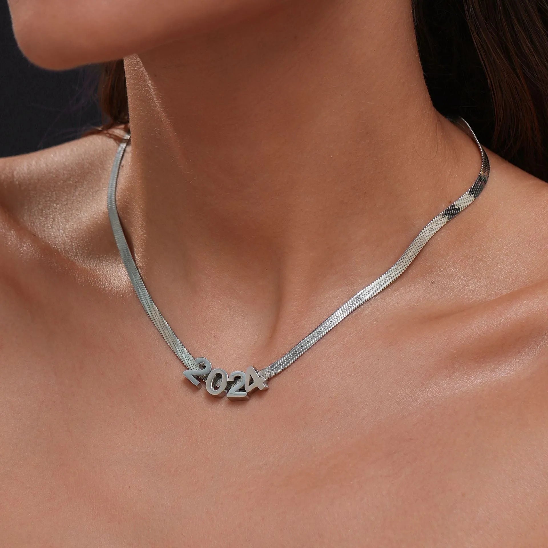 Gold titanium steel necklace with the letter A pendant on a 40.5cm blade-style chain.