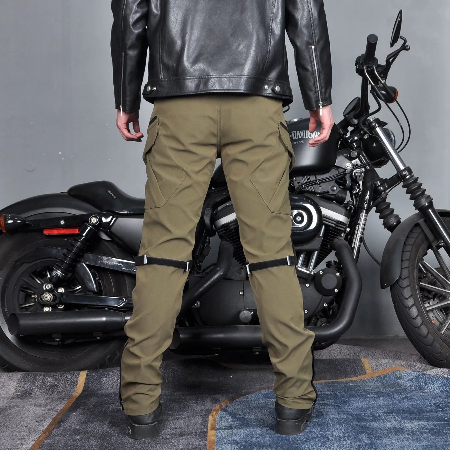 Men's waterproof black cycling trousers with removable protective gear for motorcycle use