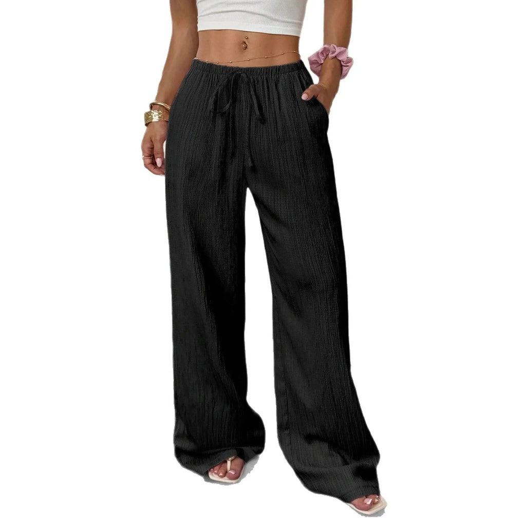 Women's black wide leg trousers with lace-up waist trimming detail on mid waist