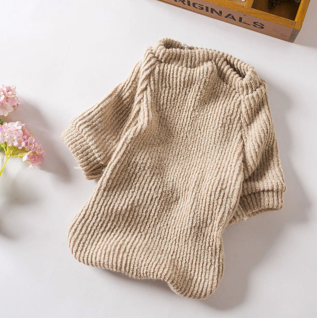 Brown cloth pullover sweater for small breed dogs on a Bichon Frise
