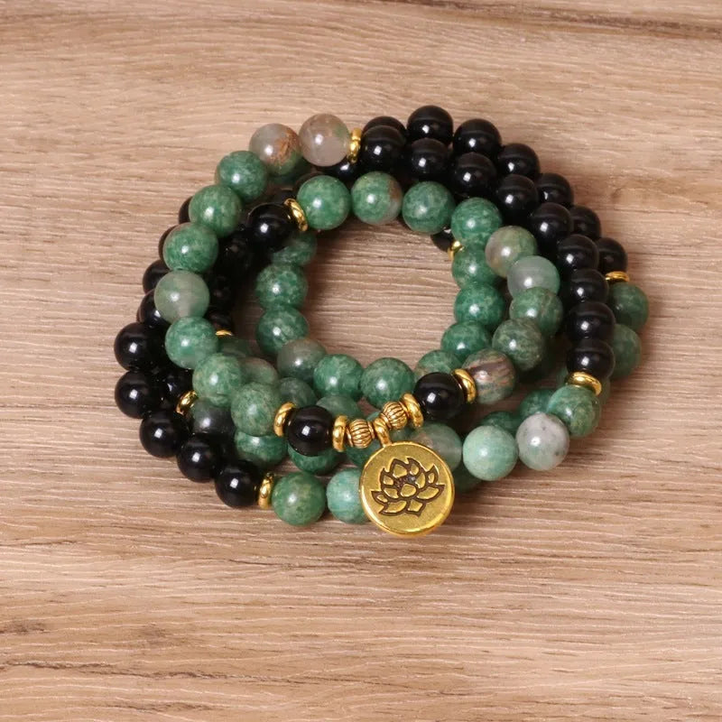 Green and black elastic beaded bracelet with alloy construction for women's wrist jewellery