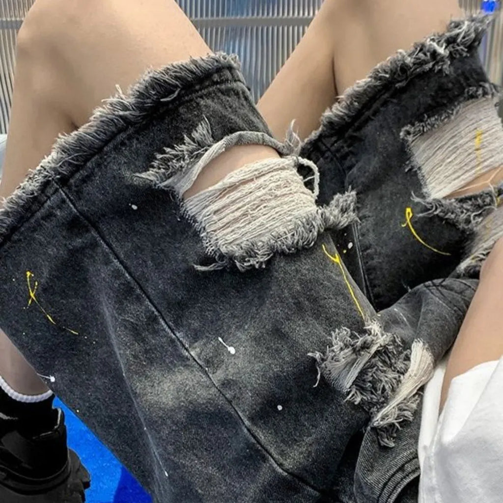 Men's loose fit denim shorts with water-washed hole design in black cotton blend fabric