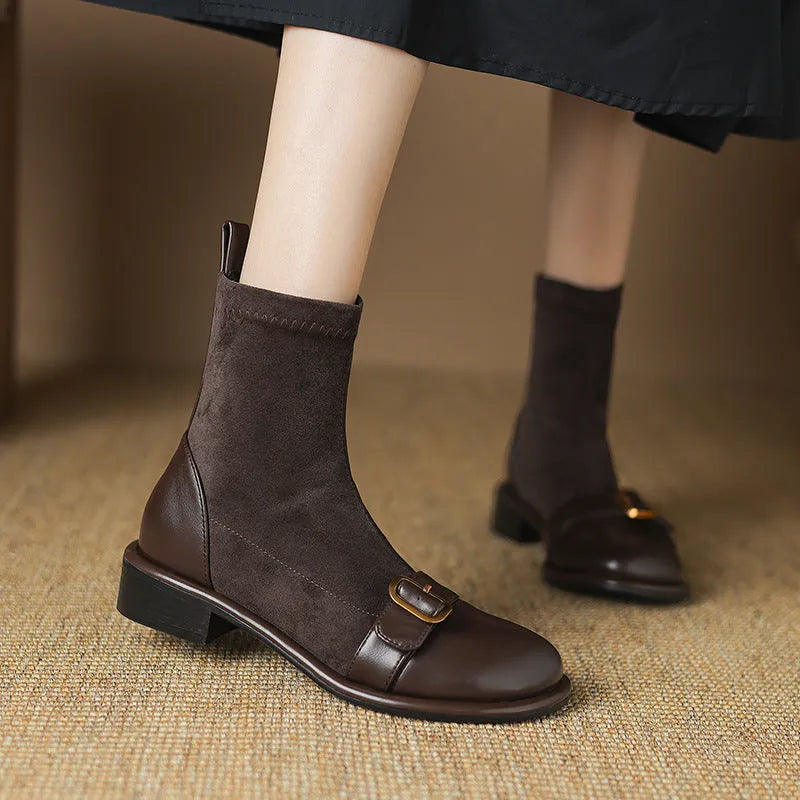 Black women's low heel Martin boots with front lace-up and decorative belt buckle stitching on a round toe.
