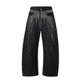 Blue loose-fitting wide-leg cotton trousers on a hanger, showing the relaxed silhouette.