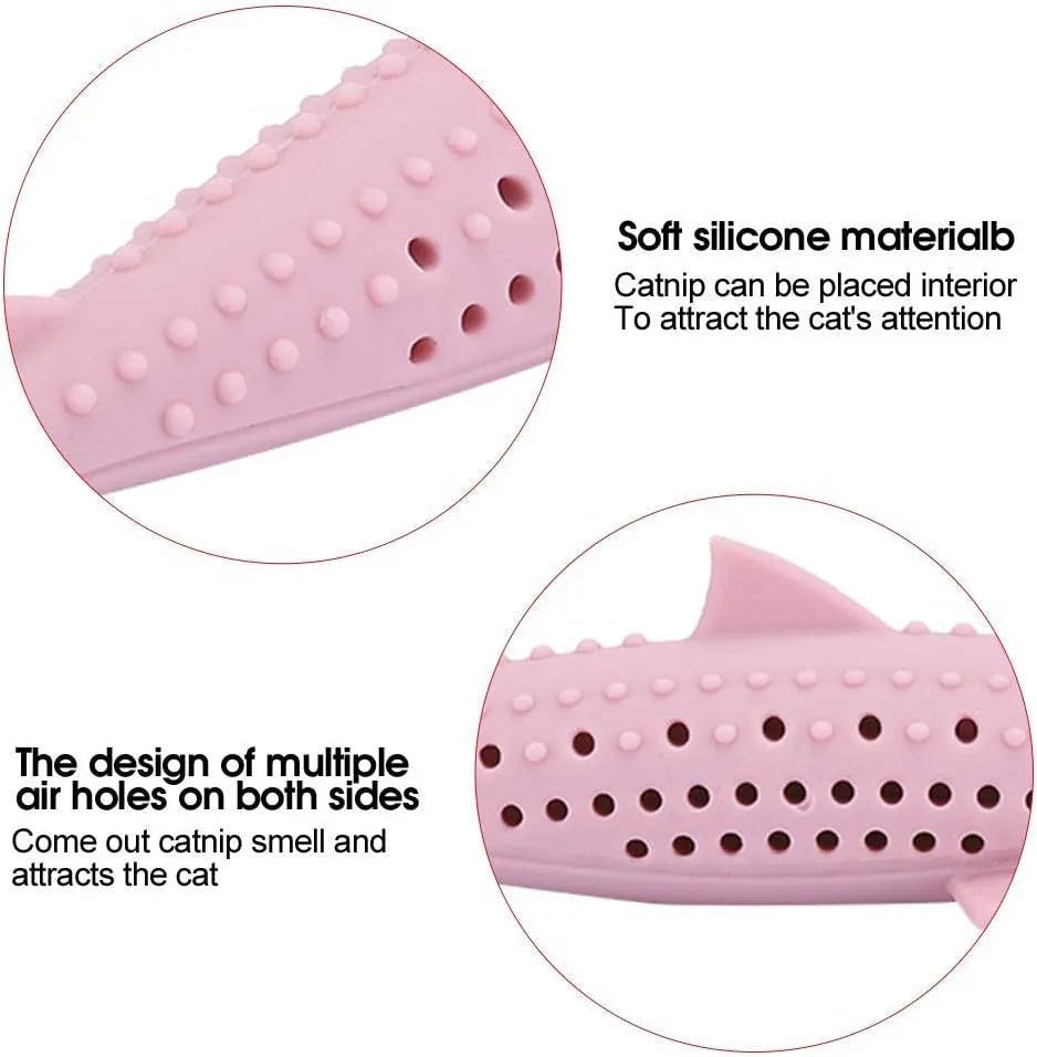 Green silicone dolphin-shaped cat chew toy on a white background, showing side air holes.