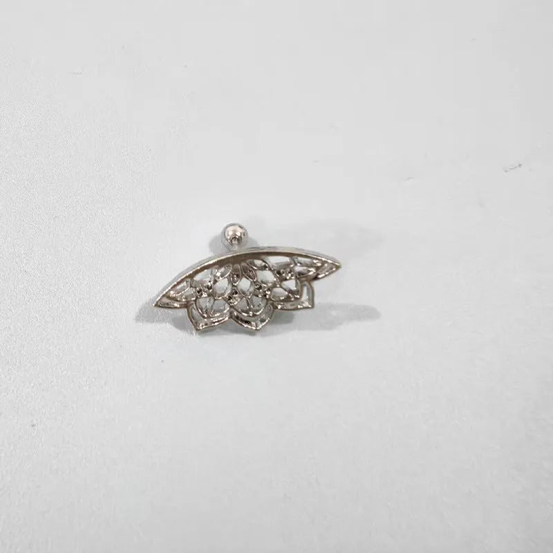 Geometric spider web stud earrings in gold and silver electroplated metal.
