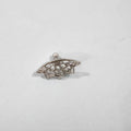 Geometric spider web stud earrings in gold and silver electroplated metal.