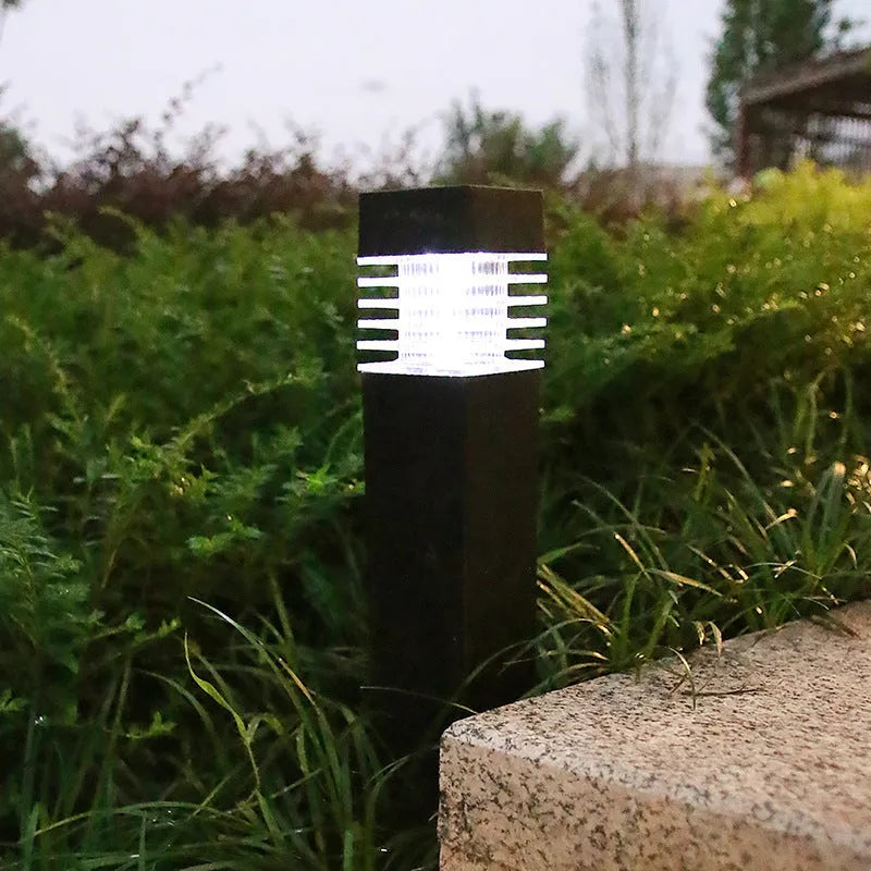 Square solar-powered lawn ground lamp for outdoor garden lighting.