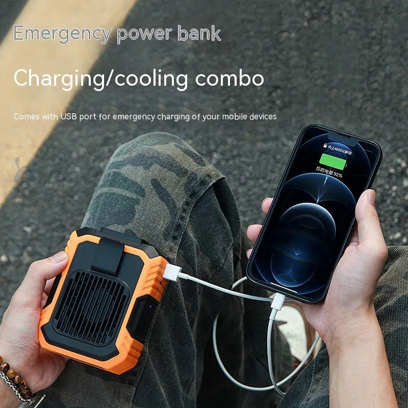 Green wrist-worn personal fan with USB charging port, LED light, and adjustable strap.